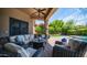 Covered patio with ample seating, outdoor decor, and manicured landscaping at 7130 E Saddleback St # 58, Mesa, AZ 85207