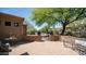 Outdoor patio with patterned brick, wrought iron gate and bench, and desert landscaping at 7130 E Saddleback St # 58, Mesa, AZ 85207