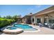 Backyard pool and patio area, featuring an outdoor dining space and lounge seating at 7130 E Saddleback St # 58, Mesa, AZ 85207