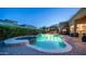 Backyard pool and spa with lush landscaping and pergola covered outdoor seating area at 7130 E Saddleback St # 58, Mesa, AZ 85207