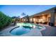 Private backyard oasis with a pool, hot tub, covered patio, and lush landscaping at 7130 E Saddleback St # 58, Mesa, AZ 85207