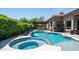 Backyard pool and patio area with a spa and waterfall feature at 7130 E Saddleback St # 58, Mesa, AZ 85207
