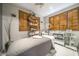 A relaxing spa room offers a serene environment with its treatment bed, wooden shutters, and professional skincare equipment at 7130 E Saddleback St # 58, Mesa, AZ 85207
