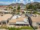 An aerial view of this home features a flat roof and a mountain range in the background at 715 W Townley Ave, Phoenix, AZ 85021