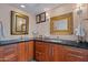 Bathroom featuring granite counters, cherry cabinets, and designer mirrors at 715 W Townley Ave, Phoenix, AZ 85021