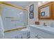 Bathroom featuring a glass shower enclosure, marble sink top, and painted floors at 715 W Townley Ave, Phoenix, AZ 85021