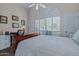 Bedroom with a neutral color palette, arched window, and white shutter blinds at 715 W Townley Ave, Phoenix, AZ 85021