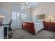 Bedroom featuring a sleigh bed, large window, and shutter-style blinds at 715 W Townley Ave, Phoenix, AZ 85021