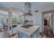 Updated kitchen with central gas cooktop and stainless appliances at 715 W Townley Ave, Phoenix, AZ 85021