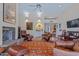Comfortable living room featuring ample seating and a stone fireplace at 715 W Townley Ave, Phoenix, AZ 85021