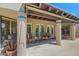 Covered patio with dining set and blue-accented columns at 715 W Townley Ave, Phoenix, AZ 85021