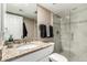 Modern bathroom features granite countertop, neutral colors, and glass-enclosed shower at 7436 E Chaparral Rd # 124B, Scottsdale, AZ 85250