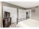 Bedroom featuring a metal frame bed, TV on dresser, and double door closets at 7436 E Chaparral Rd # 124B, Scottsdale, AZ 85250