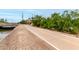 Scenic bike path with smooth pavement, lush green trees, and a bridge ahead at 7436 E Chaparral Rd # 124B, Scottsdale, AZ 85250
