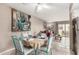Cozy dining area with seating for four, next to the kitchen and living room at 7436 E Chaparral Rd # 124B, Scottsdale, AZ 85250