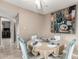 Cozy dining area with seating for four, next to the kitchen and living room at 7436 E Chaparral Rd # 124B, Scottsdale, AZ 85250