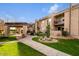 Lovely condo exteriors with balconies, lush landscaping, and community barbecue area at 7436 E Chaparral Rd # 124B, Scottsdale, AZ 85250