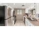 Efficient kitchen with stainless steel appliances and white cabinets at 7436 E Chaparral Rd # 124B, Scottsdale, AZ 85250