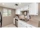 Cozy kitchen with stainless steel sink, appliances, and ample storage at 7436 E Chaparral Rd # 124B, Scottsdale, AZ 85250