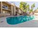 Sparkling pool with surrounding lounge chairs and nearby shade structure at 7436 E Chaparral Rd # 124B, Scottsdale, AZ 85250
