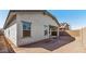 Backyard view of home with stucco exterior, showcasing the outdoor living space at 7718 W Minton St, Laveen, AZ 85339