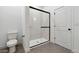 Contemporary bathroom featuring a glass-enclosed shower and modern fixtures at 7718 W Minton St, Laveen, AZ 85339