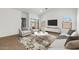 Inviting living room with comfortable seating, a flat-screen TV, and neutral color palette at 7718 W Minton St, Laveen, AZ 85339