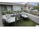 Relax on this beautifully landscaped balcony with comfortable seating and view of the community at 8180 E Shea Blvd # 1028, Scottsdale, AZ 85260
