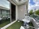 Balcony with faux grass, stylish seating, adjacent sliding glass doors, and tranquil community views at 8180 E Shea Blvd # 1028, Scottsdale, AZ 85260