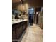 Bathroom featuring a double vanity, tiled floors, and closet for storage space at 8180 E Shea Blvd # 1028, Scottsdale, AZ 85260