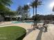 Community pool area featuring crystal clear water, lounge chairs, and a spa at 8180 E Shea Blvd # 1028, Scottsdale, AZ 85260