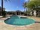 Community pool area featuring crystal clear water, lounge chairs, and covered seating at 8180 E Shea Blvd # 1028, Scottsdale, AZ 85260