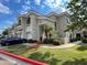 Charming condo building with well-kept landscaping, a private entrance, and a blue car parked nearby at 8180 E Shea Blvd # 1028, Scottsdale, AZ 85260