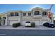 Charming two-story townhouse with three garage spaces, a welcoming entrance and neat curb appeal at 8180 E Shea Blvd # 1028, Scottsdale, AZ 85260