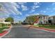 Well-maintained condo building with manicured lawns, mature trees, and ample parking spaces at 8180 E Shea Blvd # 1028, Scottsdale, AZ 85260