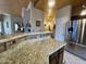 Beautiful kitchen with granite counters, tile backsplash, stainless appliances and breakfast bar at 8180 E Shea Blvd # 1028, Scottsdale, AZ 85260