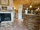 Inviting kitchen featuring a stacked stone kitchen island and stylish tile flooring at 8180 E Shea Blvd # 1028, Scottsdale, AZ 85260