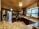 Well-appointed kitchen featuring granite countertops, stainless steel appliances, and custom cabinetry at 8180 E Shea Blvd # 1028, Scottsdale, AZ 85260