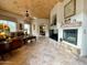 Comfortable living room with a stone fireplace and abundant natural light at 8180 E Shea Blvd # 1028, Scottsdale, AZ 85260