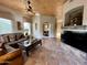 A living room boasts tile floors, fireplace and views to other rooms at 8180 E Shea Blvd # 1028, Scottsdale, AZ 85260