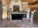 Bright living room featuring tile flooring and a stone fireplace at 8180 E Shea Blvd # 1028, Scottsdale, AZ 85260