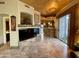 Living room boasts stone fireplace, open to the kitchen and patio at 8180 E Shea Blvd # 1028, Scottsdale, AZ 85260