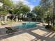 Community pool surrounded by lush greenery and lounge chairs, perfect for relaxation at 8180 E Shea Blvd # 1028, Scottsdale, AZ 85260