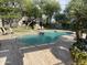 Relaxing community pool with a fountain feature, surrounded by lush landscaping and lounge chairs at 8180 E Shea Blvd # 1028, Scottsdale, AZ 85260