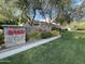 Inviting community entrance sign amidst lush greenery, showcasing the address and community name at 8180 E Shea Blvd # 1028, Scottsdale, AZ 85260