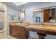Bathroom offers vanity with sink, mirror, and natural stone counter at 8545 E Heatherbrae Dr, Scottsdale, AZ 85251