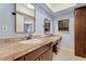 Bathroom features vanity with sink and mirror, storage cabinet, and soft blue walls at 8545 E Heatherbrae Dr, Scottsdale, AZ 85251