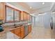 Kitchen features granite countertops, stainless steel appliances, recessed lighting, and wood cabinets at 8545 E Heatherbrae Dr, Scottsdale, AZ 85251