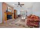 Comfortable living room with a fireplace and natural light and laminate floors at 8545 E Heatherbrae Dr, Scottsdale, AZ 85251