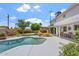 Beautiful pool with spacious patio and manicured landscaping, creating a serene outdoor oasis at 8545 E Heatherbrae Dr, Scottsdale, AZ 85251